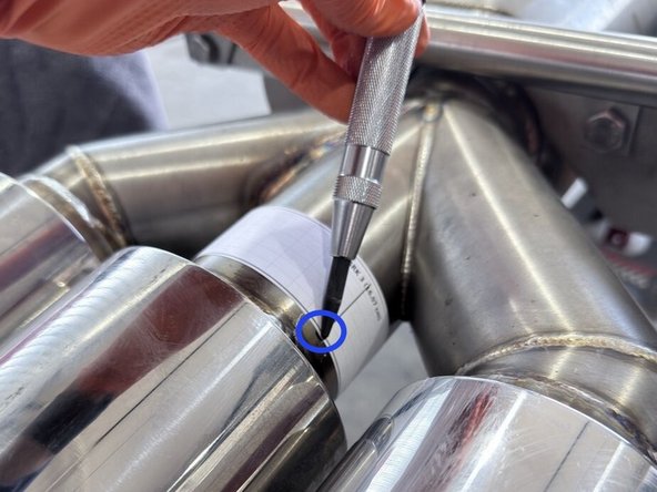 Mark the location of the final two holes and drill