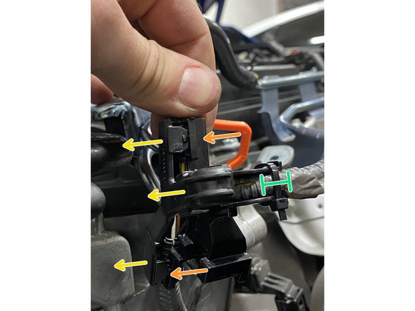 Using a small flat head screwdriver, pry the tabs out