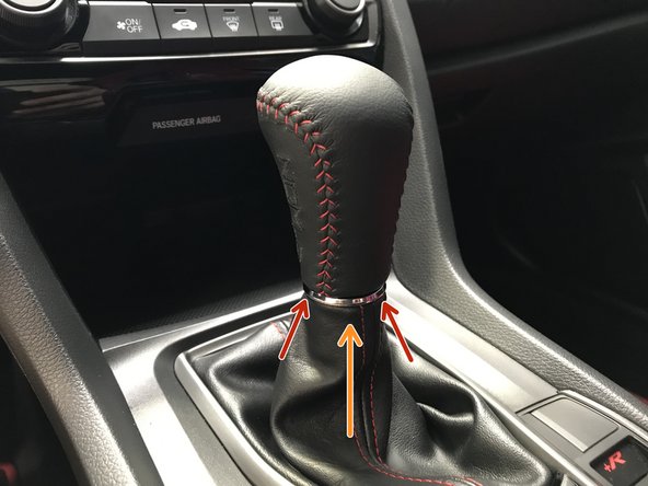 Locate the silver ring on the shift boot as shown