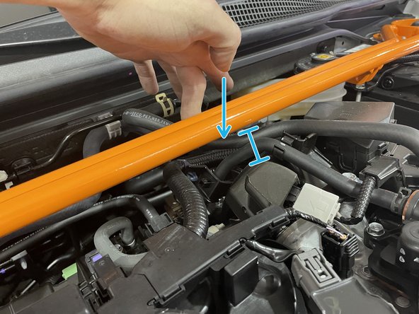 To stop the hose from rubbing on the FSTB during engine movement, the hose must be zip tied to the adjacent hose with the provided zip tie