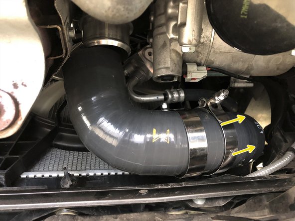 Install the two supplied 60-68mm clamps near the center of the boost tube as shown