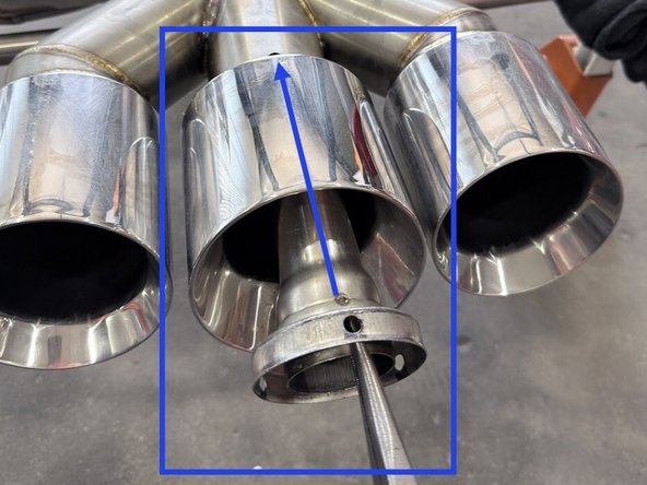 Test fit exhaust silencer into muffler by placing it into the center tip as shown until the top mounting hole on silencer lines up with the hole just drilled