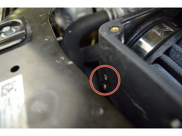 Now that the airbox is in position. Attach the provided short bracket to the airbox with (2) M5x0.8X12mm hex head bolts and a 8mm wrench