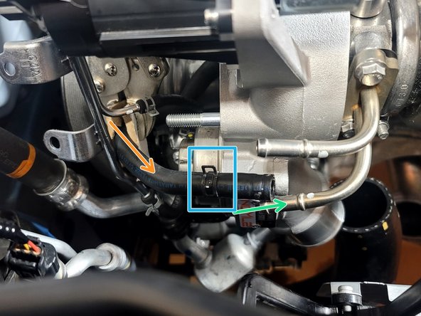 Route coolant line through vacuum hard line as shown