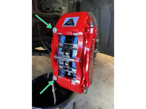 Install the caliper to the caliper bracket using a 10mm Allen key and bolts provided