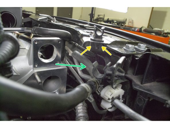 Use needle nose pliers to squeeze the clip on the bottom of the hood bracket to remove the plastic clip. Set aside for reuse later