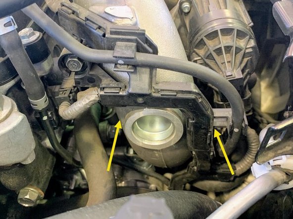 The (2) 12mm bolts are shown off the car to better demonstrate their location