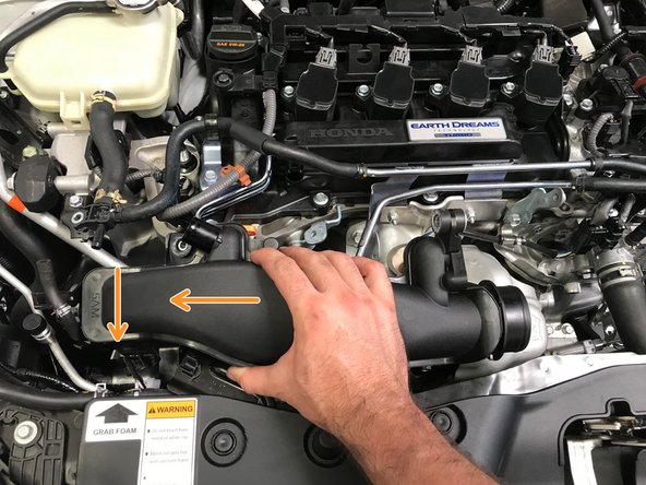 Pull the oil dip stick out a couple inches and flex out of way