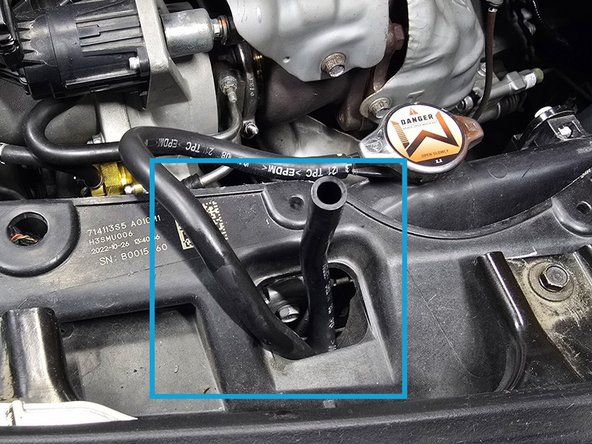 Once the reservoir is completely empty use your hand to pull the OE coolant hose off of the OE reservoir