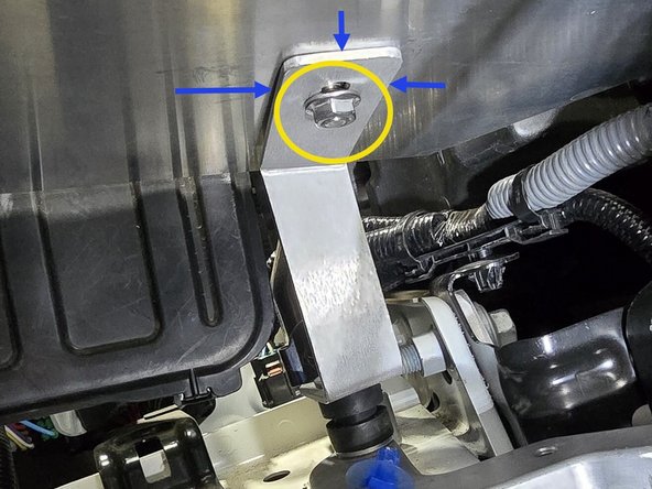 Press the provided 12mm bolt through the shroud and the bottom bracket