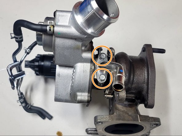 Remove both bolts from OE drain with 10mm socket and ratchet