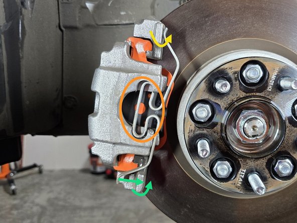 Using one hand press and hold the center of the clip into the round cut out as shown