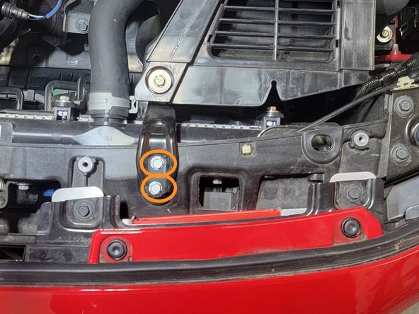 Use a 10mm socket and 3/8&quot; ratchet to remove the two (2) bolts securing the intake bracket