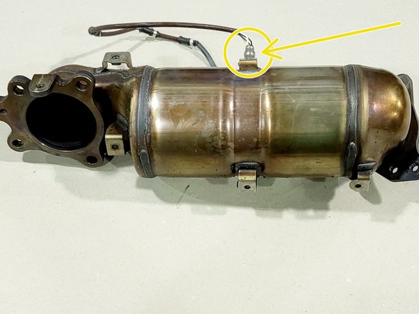 Using a 1/4&quot; drive and 10mm socket, remove the four (4) 10mm bolts securing the OEM heat shield to the OEM downpipe