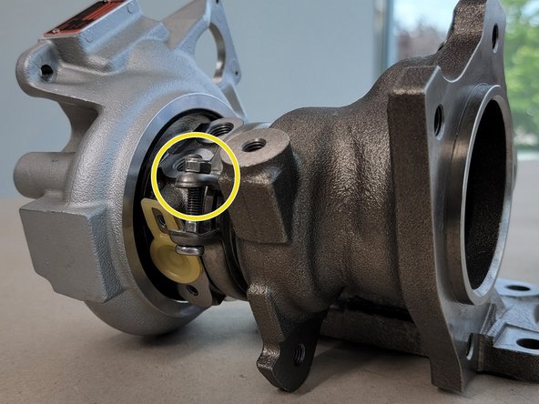 Push on both sides of the turbo to push the two flanges together