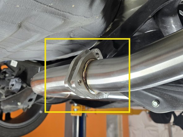 In one go, insert a provided &quot;tri-bolt&quot; gasket between the rear mid-pipe flange and the muffler flange then insert a bolt and washer to hold the sections together