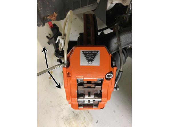 Have the person in the driver's seat press the brake pedal 3-5 times until there is sufficient pedal pressure. Then, have them hold the brake pedal firmly as the bleed screw is loosened. The pedal will go to the floor while fluid and air will enter the bottle. Make sure your friend holds the pedal down as you retighten the bleed screw.