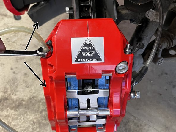 Have the person in the driver's seat press the brake pedal 3-5 times until there is sufficient pedal pressure. Then, have them hold the brake pedal firmly as the bleed screw is loosened. The pedal will go to the floor while fluid and air will enter the bottle. Make sure your friend holds the pedal down as you retighten the bleed screw.