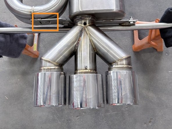 The silencer can be installed with one bolt. For a more sturdy install we'll demonstrate all three here