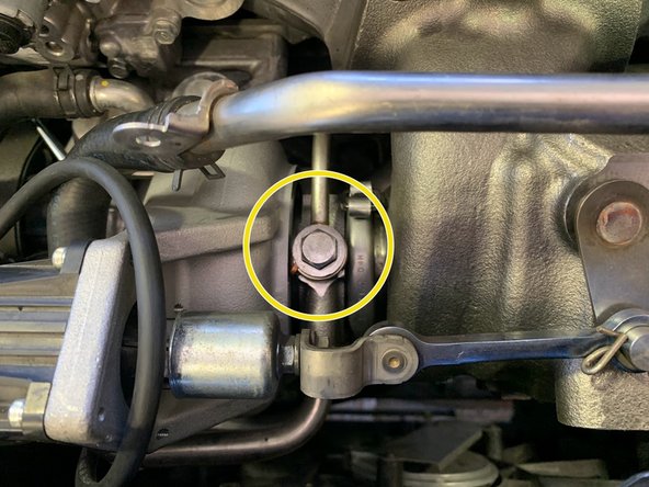 Route the oil feed line and using the provided 14mm Banjo bolt, reinstall as shown. Torque to 21 ft-lb