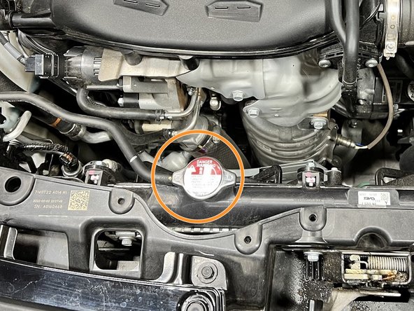 Radiator cap is now underneath the shroud