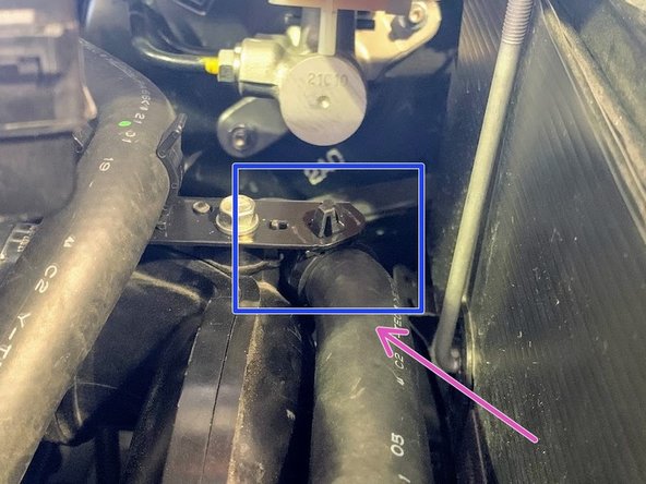 Master cylinder brace will contact a coolant line if coolant line is not moved