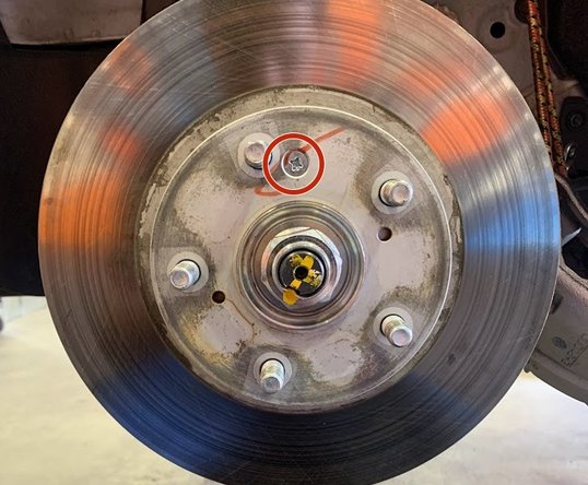 Use a #3 Phillps screwdriver to remove the rotor retention screw