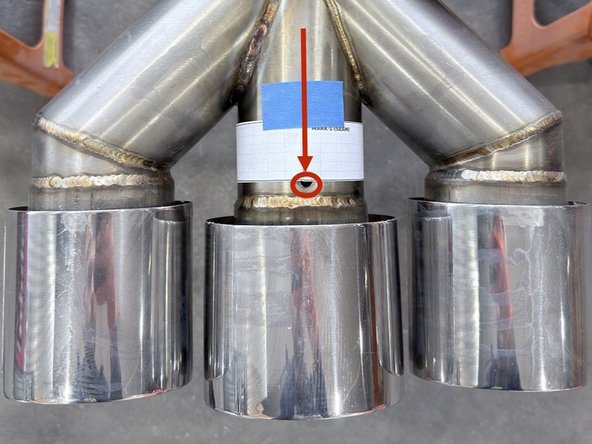 Apply the included template to the exhaust piping aligning the first hole you made to the location "Mark 1" by wrapping around as shown and securing with blue tape