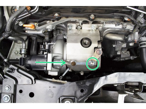 Install the WGA through the compressor housing and attach the WGA rod to the waste gate arm