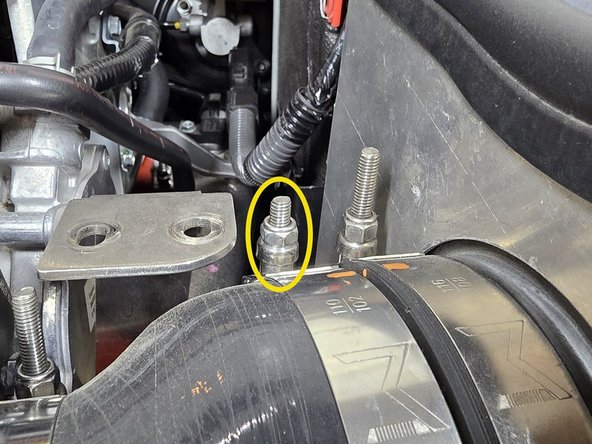 Using a 10mm socket, tighten the 102-110mm clamp over the silicone until there is enough threads sticking out to verify position, but still loose enough to rotate the clamp