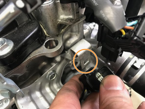 Install the primary O2 sensor wiring harness onto the bracket