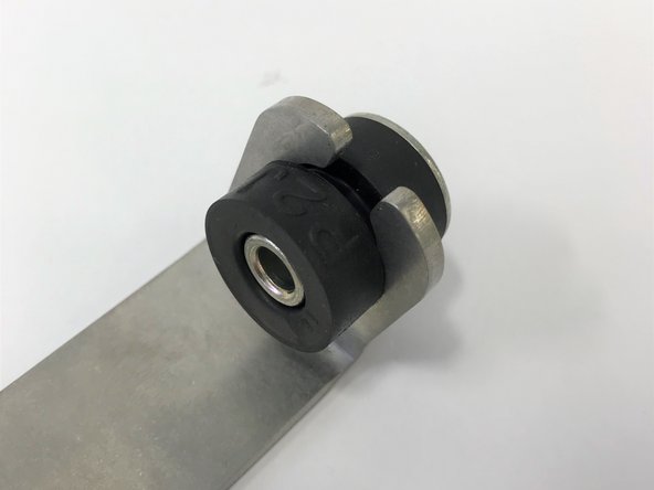 Install the OE rubber mount and steel collar as shown