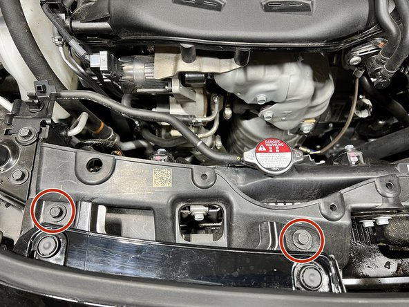 Locate the 2x 10mm bolts and remove them from the car. You will not reuse these bolts later