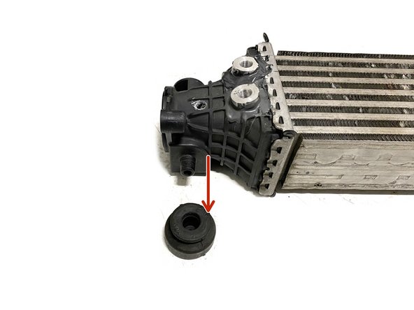 Remove the two (2) OEM rubber mounts from the bottom of the intercooler