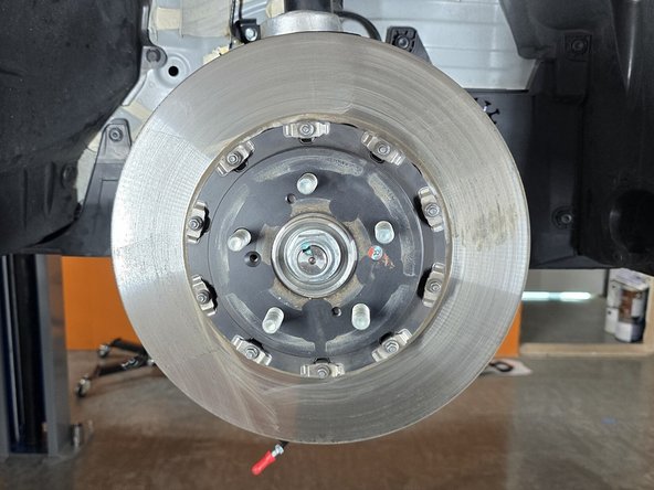 If the rotor is heavily worn, you may need to spread the brake pads apart to gain clearance