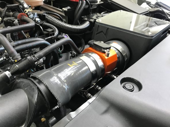 Pivot the MAF &amp; Silicone assembly down and onto the turbo inlet pipe