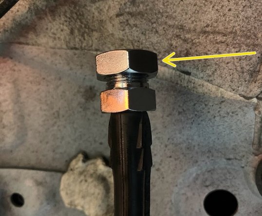 Remove the large 19mm nut from the brake line