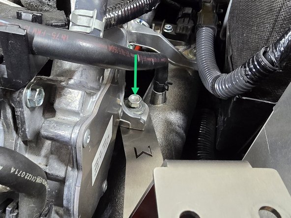 Reinstall the previously removed bolt and washer. Leave this bolt loose as you will need to move the bracket around for the next couple of steps