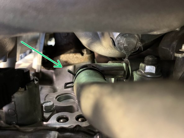 Follow the line down and find the lower clamp holding the hose