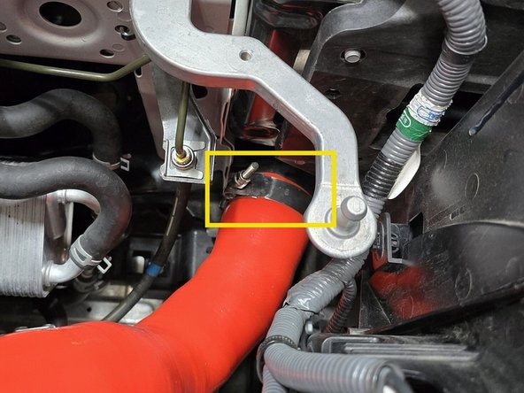 Correctly position the 63-71mm clamp over the Intercooler and tighten with a 10mm socket, a 12" extension, and a 3/8" drive ratchet until the silicone starts to bulge slightly at the edge of the clamp