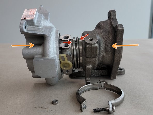 Wrap the V-band clamp  around the CHRA and the turbine housing ensuring both flanges are caught by the clamp
