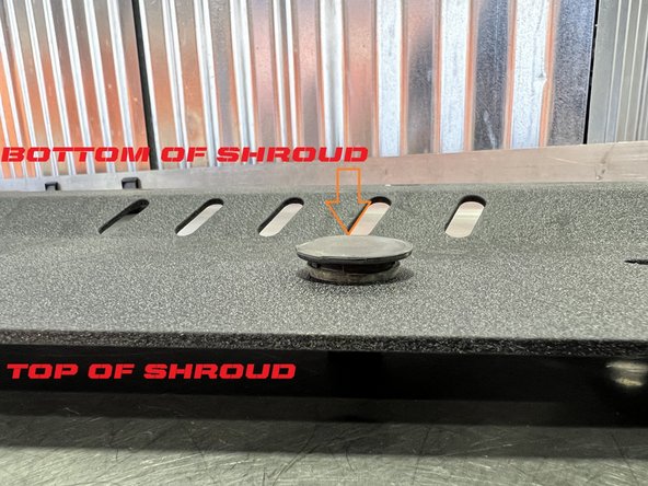 Flip the shroud over and insert the rubber stop down so the tip of the cone goes in first and is pointing up when the shroud is flipped back over