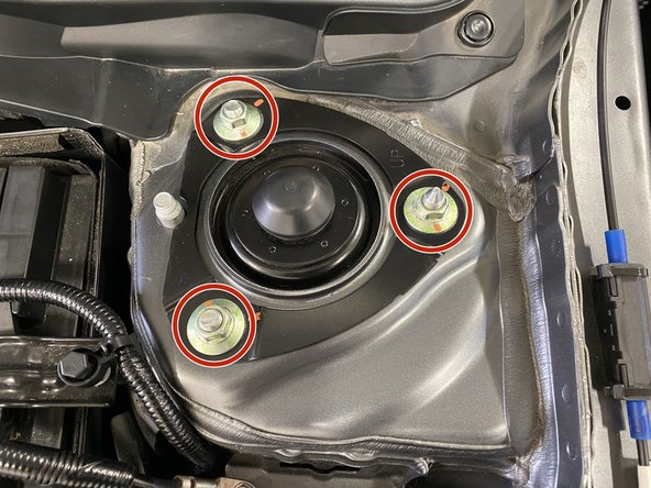 Remove three (3) flange nuts with a 14mm deep socket and ratchet wrench