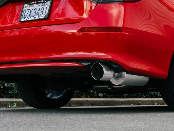 Stand back several feet from the car and inspect the exhaust
