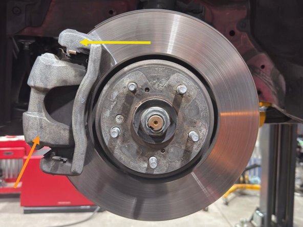 Remove the front wheels/tires using your lug nut socket and breaker bar