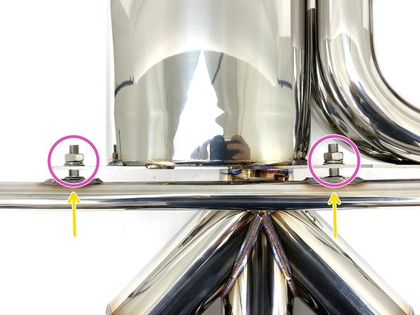 The longer side of the hanger bar (shown with orange mark) will attach on the same side as the side branch resonators (yellow arrow)