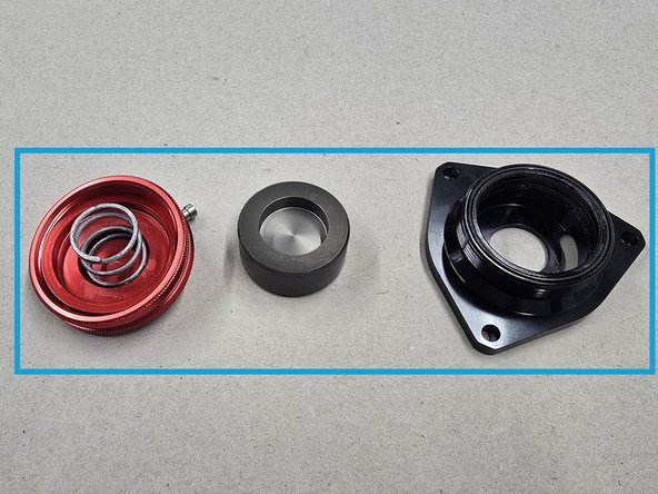 Flip the BPV over and press on the center of the internal piston as shown