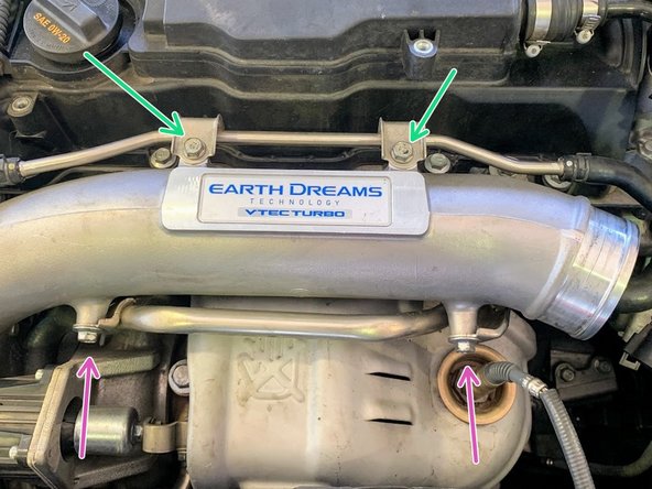 Remove (2) 10mm bolts securing the hard water line to the inlet pipe and move out of the way