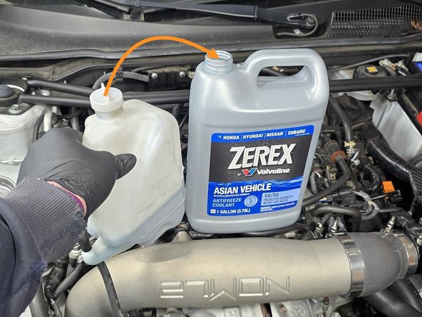 To ensure a clean install, you will need to drain the OE coolant reservoir into another container