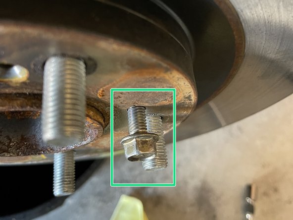 If the rotor is seized, use a M6x1.00 bolt removed from Step 5 to thread into the threaded holes of the rotor and it will be lifted from the hub